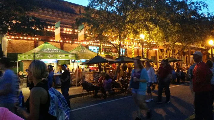 Outdoor dining and evening activity on Palafox Street in Downtown Pensacola