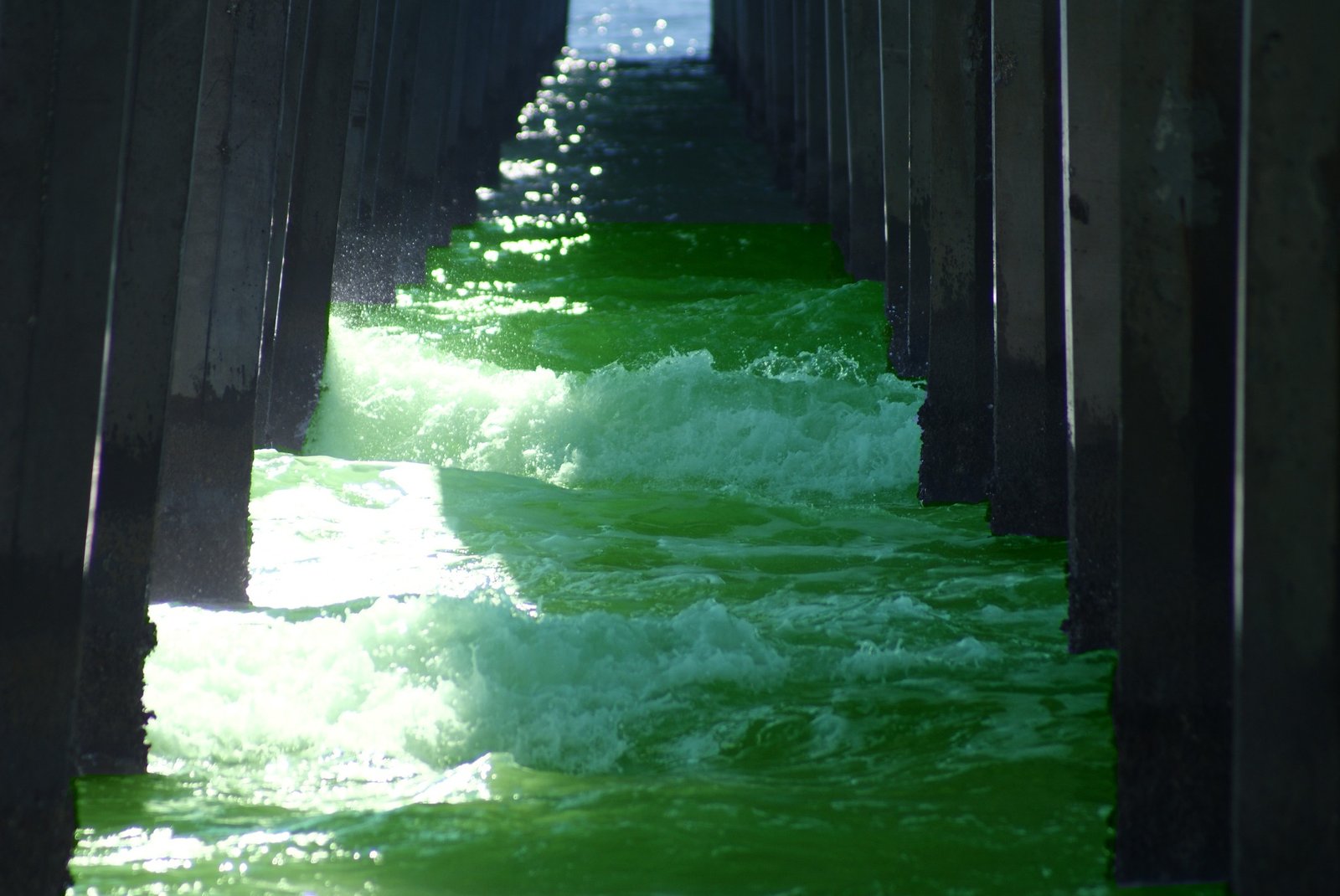Gulf waves beneath the Pensacola Beach pier